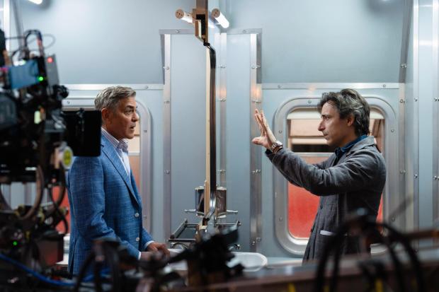 George Clooney running on set while filming Jay Kelly