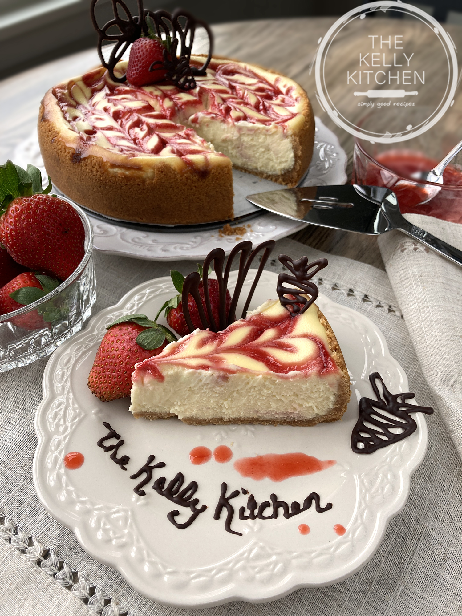 Strawberry-topped baked cheesecake on a serving plate